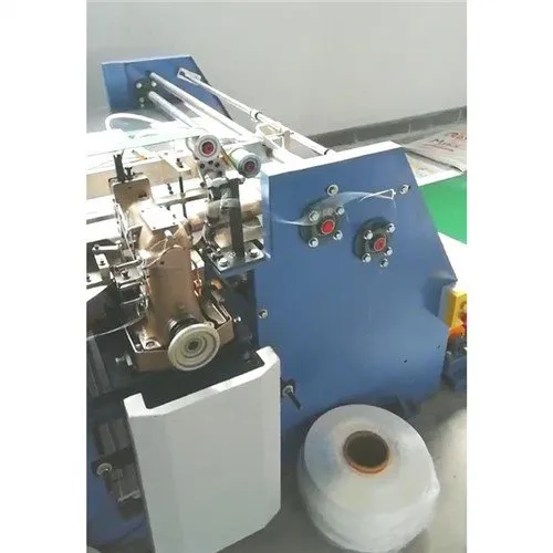 Màquina de tallar i cosir de doble puntada